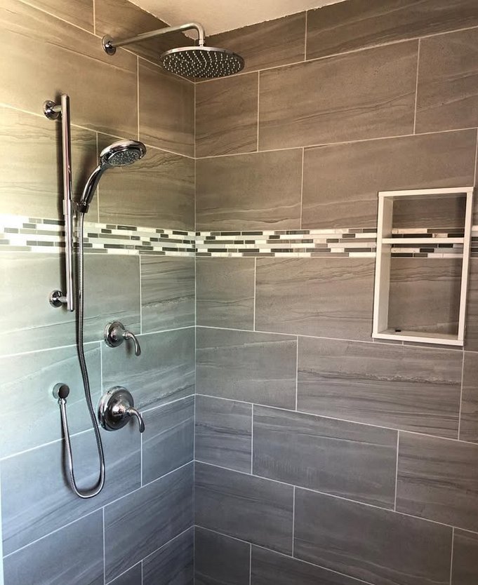 Custom tiled shower with rain head and niche